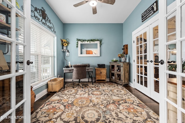 office space featuring french doors, ceiling fan, baseboards, and wood finished floors