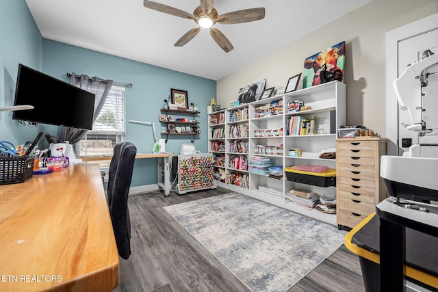 office area featuring ceiling fan, baseboards, and wood finished floors