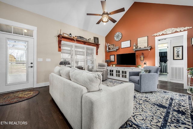 living room featuring visible vents, baseboards, a ceiling fan, wood finished floors, and high vaulted ceiling