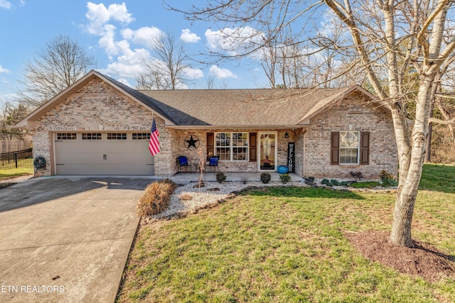 single story home with an attached garage, a front lawn, concrete driveway, and brick siding