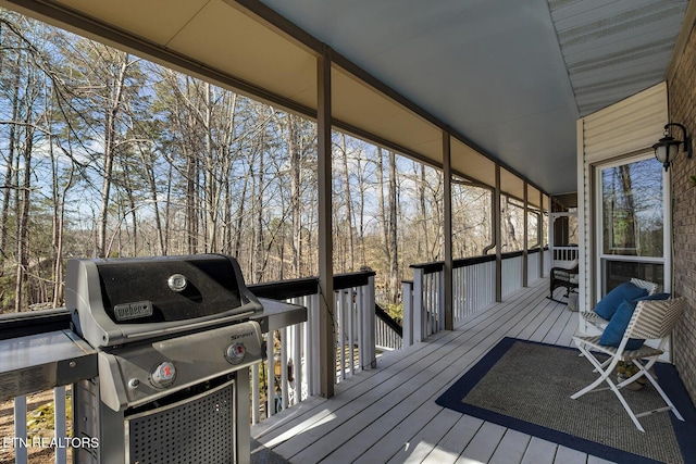 wooden terrace with area for grilling