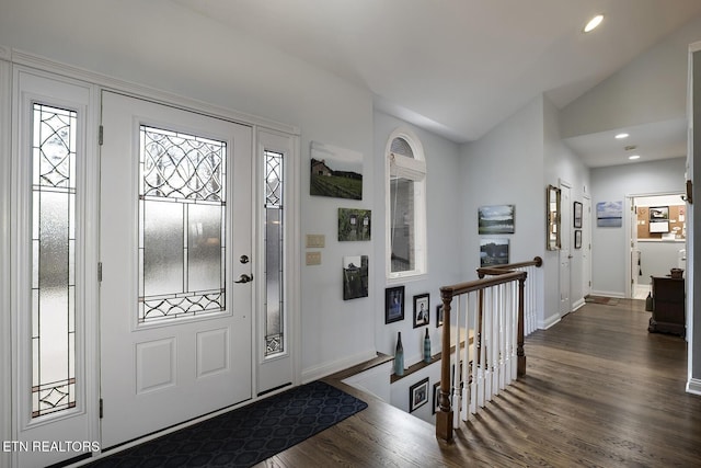 entrance foyer featuring baseboards, vaulted ceiling, dark wood-type flooring, and recessed lighting