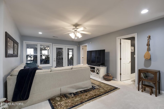 living room with carpet floors, visible vents, a ceiling fan, and recessed lighting