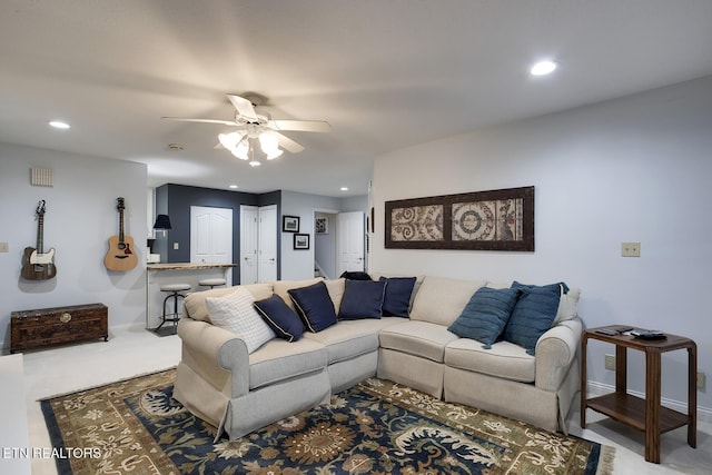 carpeted living area with a ceiling fan, recessed lighting, and baseboards