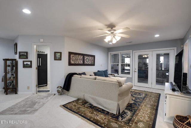 living area with ceiling fan, recessed lighting, light carpet, visible vents, and baseboards