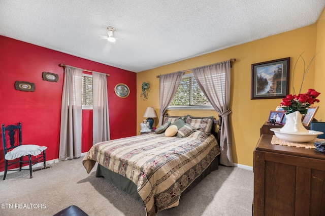 bedroom featuring carpet flooring, a textured ceiling, and baseboards