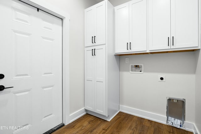 laundry area featuring cabinet space, baseboards, dark wood-style flooring, washer hookup, and electric dryer hookup