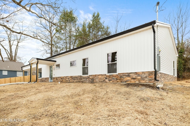 view of home's exterior with stone siding