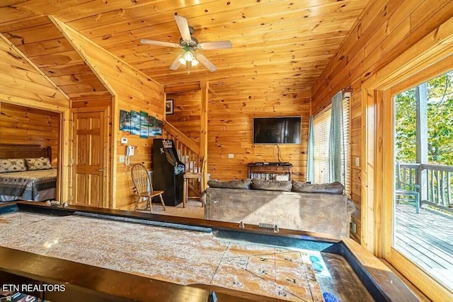 game room featuring vaulted ceiling, wood ceiling, and wooden walls