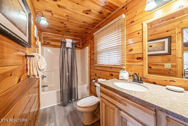 full bath featuring toilet, wood ceiling, shower / bathtub combination with curtain, vanity, and wood walls