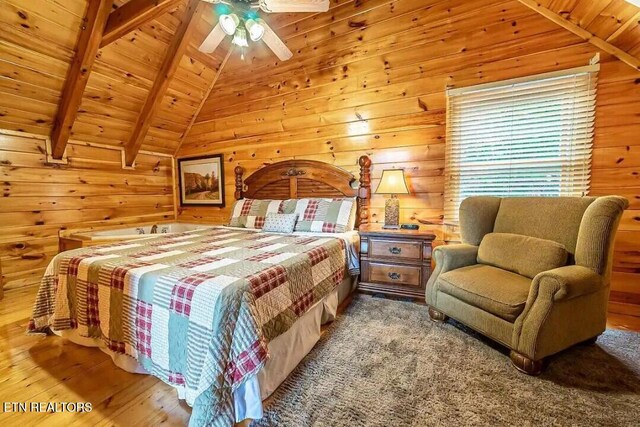 bedroom featuring wood ceiling, ceiling fan, wood finished floors, vaulted ceiling with beams, and wood walls