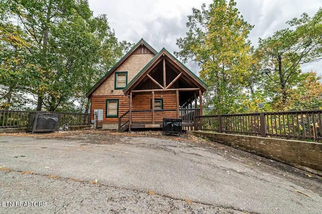 log cabin with fence