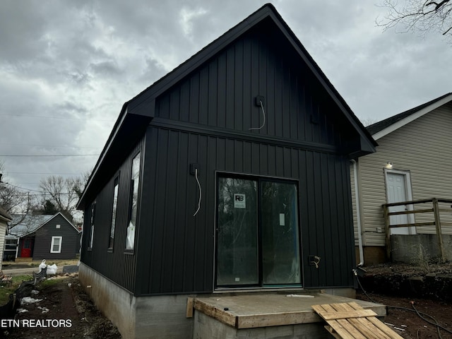 back of property with board and batten siding