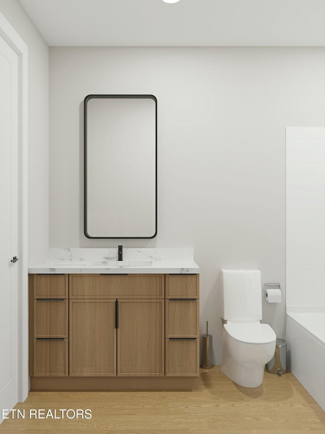 full bath featuring vanity, toilet, and wood finished floors