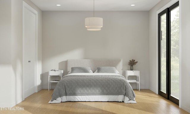 bedroom featuring recessed lighting, baseboards, and light wood finished floors