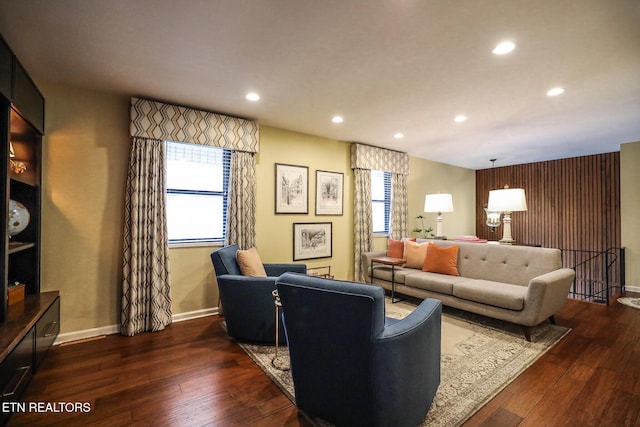 living room with recessed lighting, baseboards, and hardwood / wood-style floors