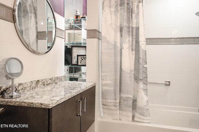 full bath featuring shower / tub combo and vanity