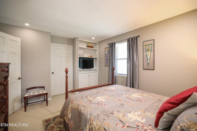 bedroom with a textured ceiling, recessed lighting, baseboards, and light colored carpet