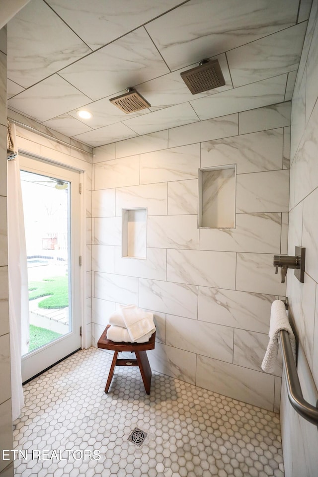 bathroom with tiled shower