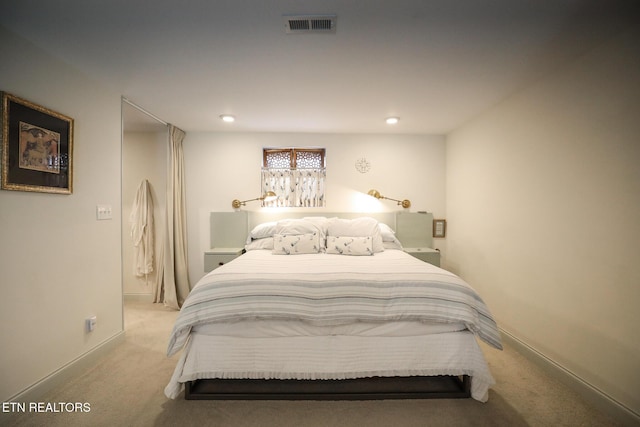 carpeted bedroom featuring baseboards, visible vents, and recessed lighting