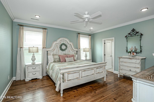 bedroom featuring ornamental molding, dark wood-type flooring, visible vents, and baseboards