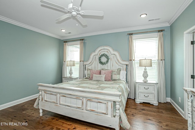 bedroom featuring dark wood finished floors, visible vents, and crown molding