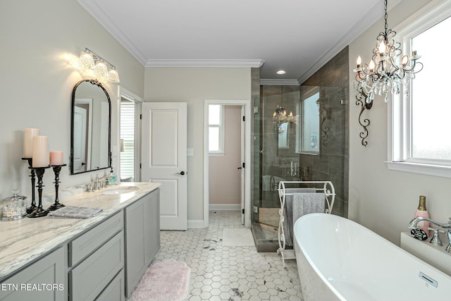 bathroom featuring ornamental molding, a freestanding bath, vanity, a shower stall, and a chandelier