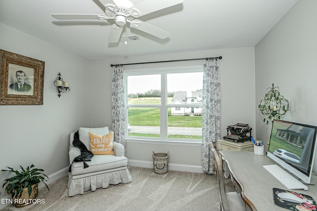 carpeted home office with ceiling fan, visible vents, and baseboards