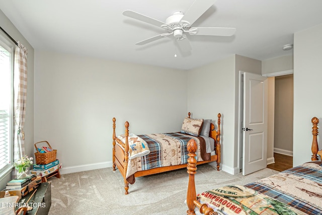 bedroom with carpet floors, ceiling fan, and baseboards