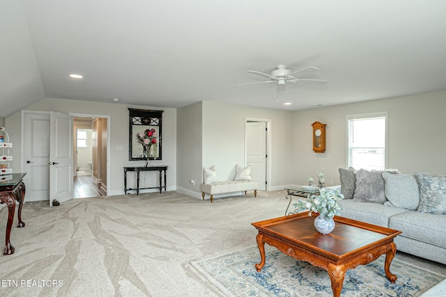 living room with baseboards, ceiling fan, recessed lighting, and light colored carpet