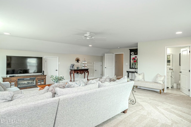 living room with light carpet, baseboards, a ceiling fan, and recessed lighting