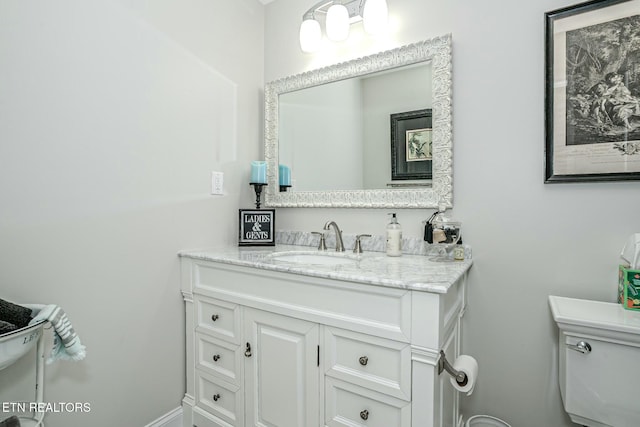 half bath with vanity and toilet