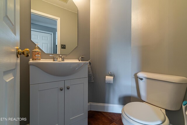 4404 Aylesbury Dr, Knoxville, TN 37918 - half bath with baseboards, toilet, vanity, and tile patterned floors
