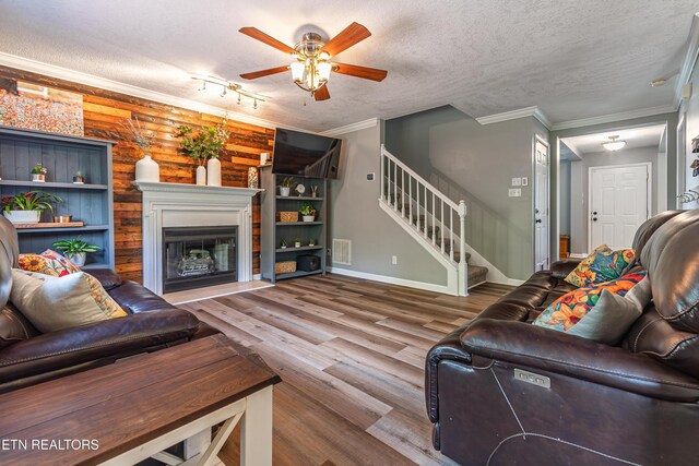 4404 Aylesbury Dr, Knoxville, TN 37918 - living room featuring stairway, a ceiling fan, wood finished floors, crown molding, and baseboards