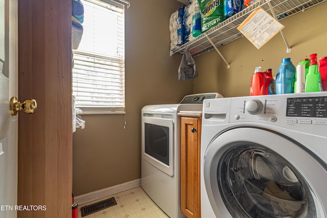 4404 Aylesbury Dr, Knoxville, TN 37918 - laundry area with independent washer and dryer, plenty of natural light, light flooring, and baseboards