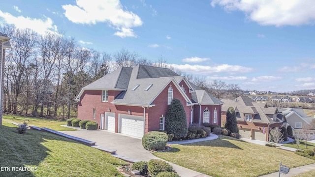 view of front of property with driveway, brick siding, a front lawn, and an attached garage