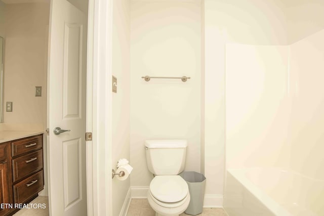 full bath with tile patterned flooring, vanity, toilet, and baseboards