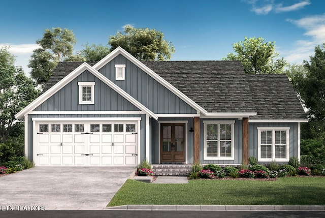 view of front facade with a shingled roof, a front lawn, and concrete driveway