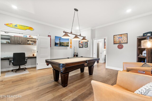 rec room featuring light wood-style floors, baseboards, and ornamental molding