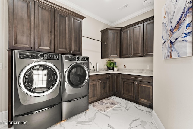 laundry room featuring marble finish floor, cabinet space, visible vents, ornamental molding, and washer and dryer