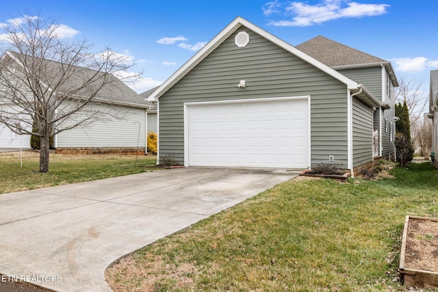 exterior space featuring a garage, driveway, and a lawn