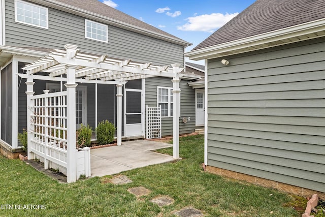 back of house featuring roof with shingles, a patio, a lawn, and a pergola