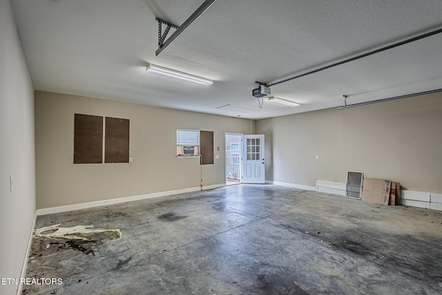 garage featuring a garage door opener, cooling unit, and baseboards