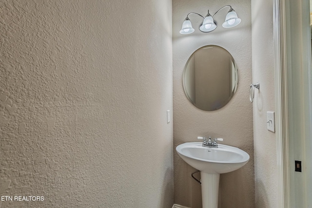 bathroom with a textured wall