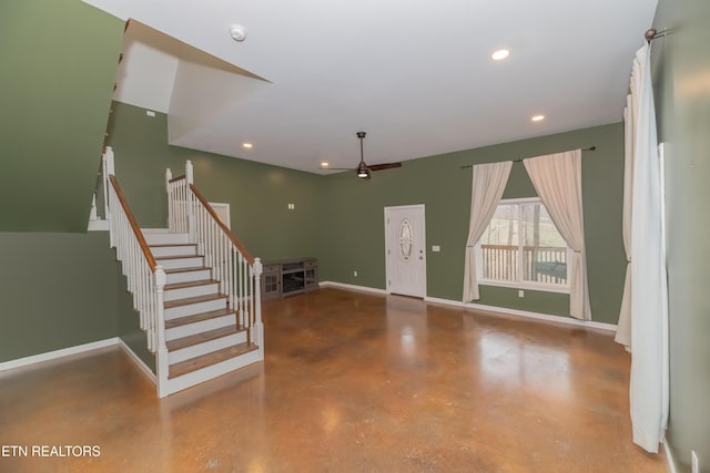 interior space with baseboards, ceiling fan, stairway, concrete flooring, and recessed lighting