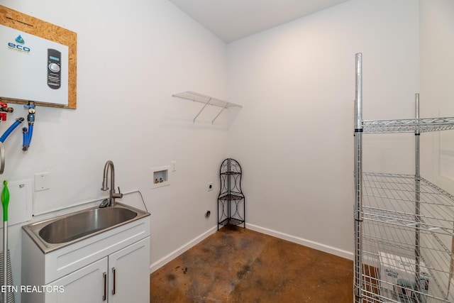 washroom featuring washer hookup, tankless water heater, cabinet space, hookup for an electric dryer, and a sink