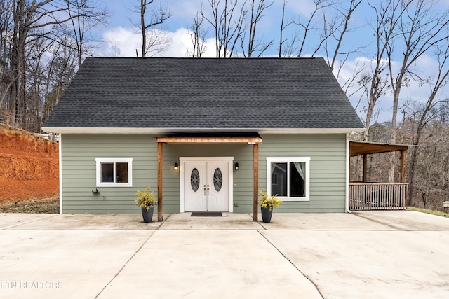 view of front of house with a shingled roof