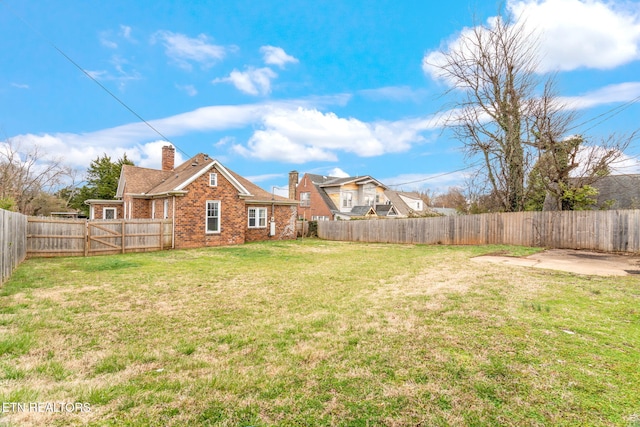 view of yard featuring a fenced backyard