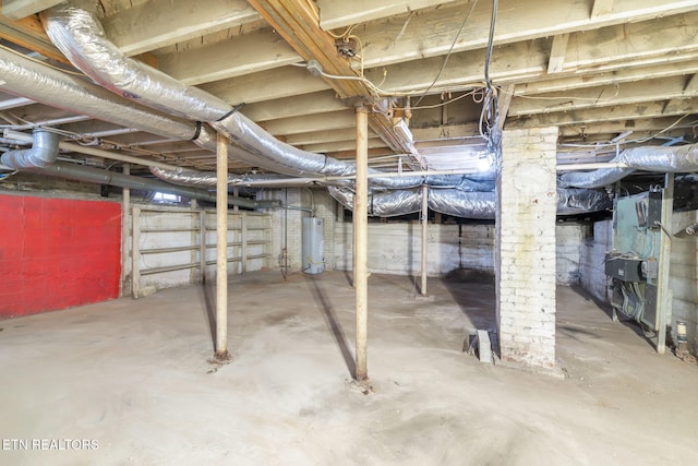 unfinished basement with water heater