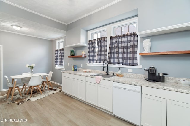 kitchen featuring open shelves, light wood-style flooring, ornamental molding, a sink, and dishwasher